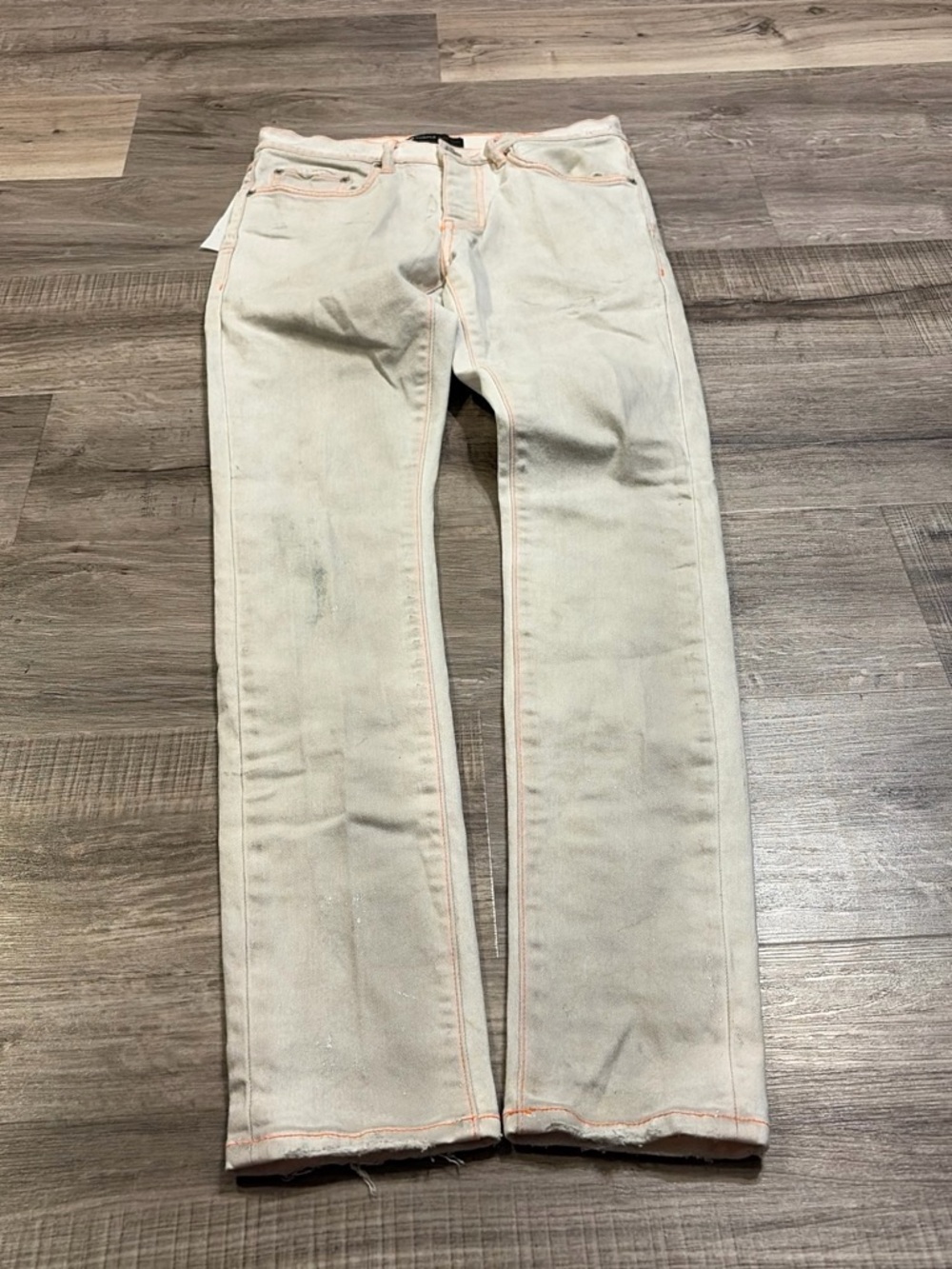 Cream and orange purple brand jeans